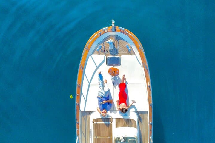 Private Capri Boat Tour: Circumnavigate Faraglioni & Grottos from Sorrento