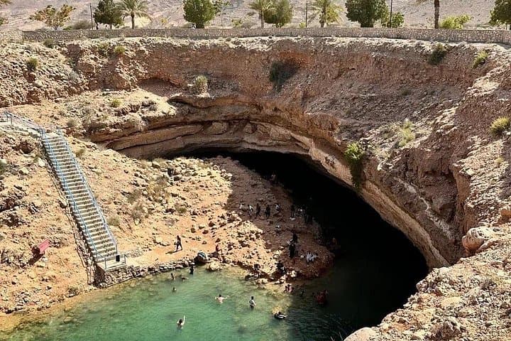 Wadi Shab and Bimmah Sinkhole: Hiking & Swimming Day Trip from Muscat photo 1