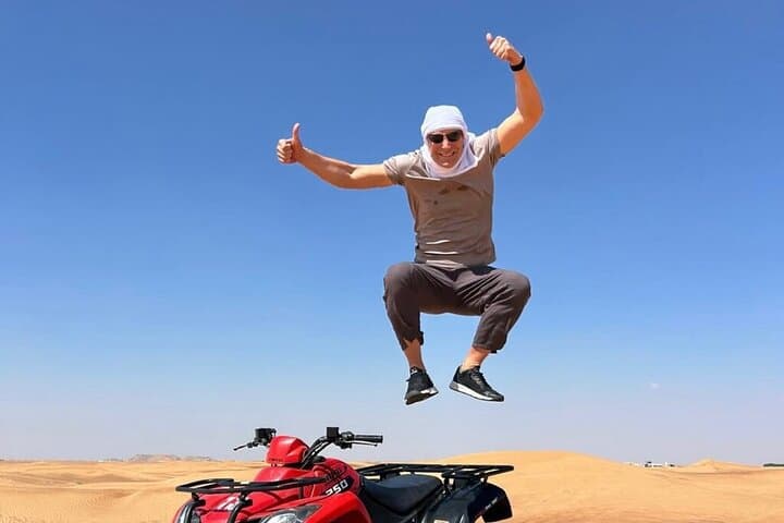 Dubai Red Dunes ATV, Camel Ride & BBQ — All‑Inclusive Desert Adventure