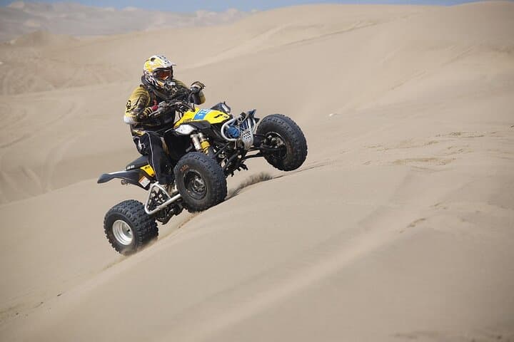 Dubai Red Dune Quad Bike Adventure with BBQ Dinner & Live Show