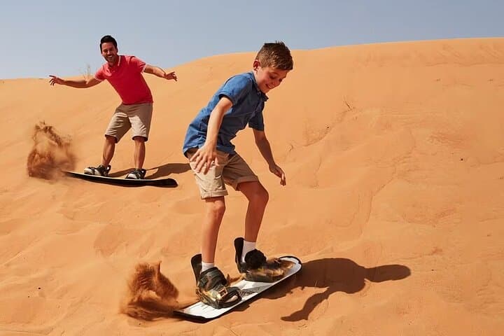 Morning Red Dunes Safari in Dubai: Dune Bashing, Camel Ride & Sandboarding photo 2