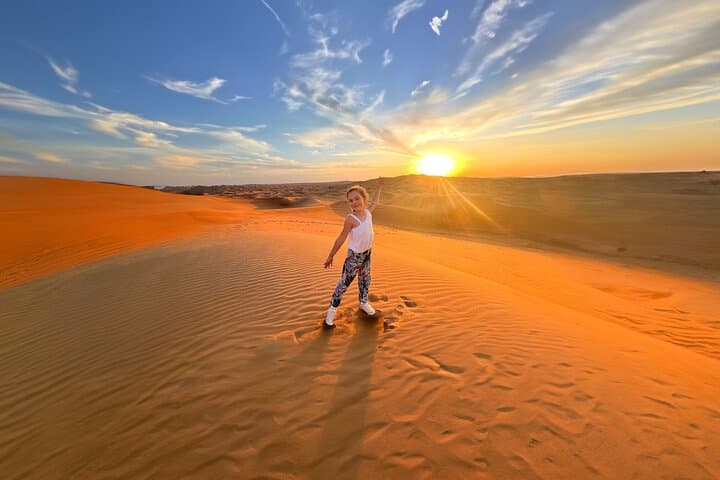 Morning Red Dunes Safari in Dubai: Dune Bashing, Camel Ride & Sandboarding photo 4
