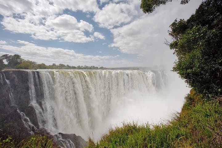 Victoria Falls Guided Tour: Zimbabwe to Zambia Rainforest, Bridge & Zambezi Views photo 5