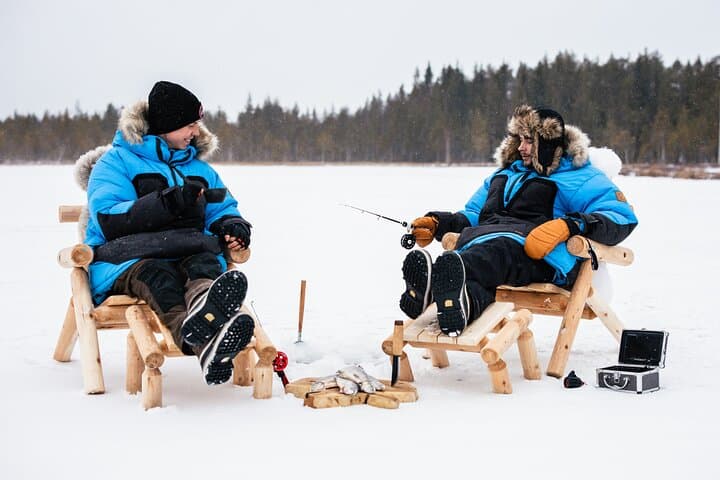 Lapland Ice Fishing VIP Tour with Snowmobile Ride & Glass Igloo Lunch photo 1