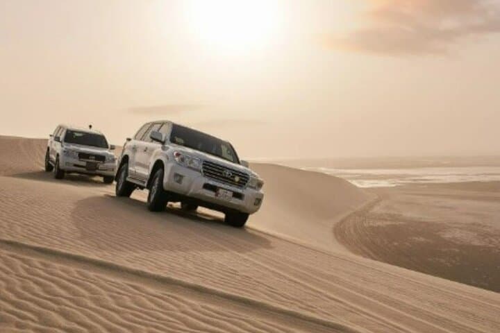 Doha Inland Sea Desert Safari — Dune Bashing, Sandboarding & Camel Ride photo 1