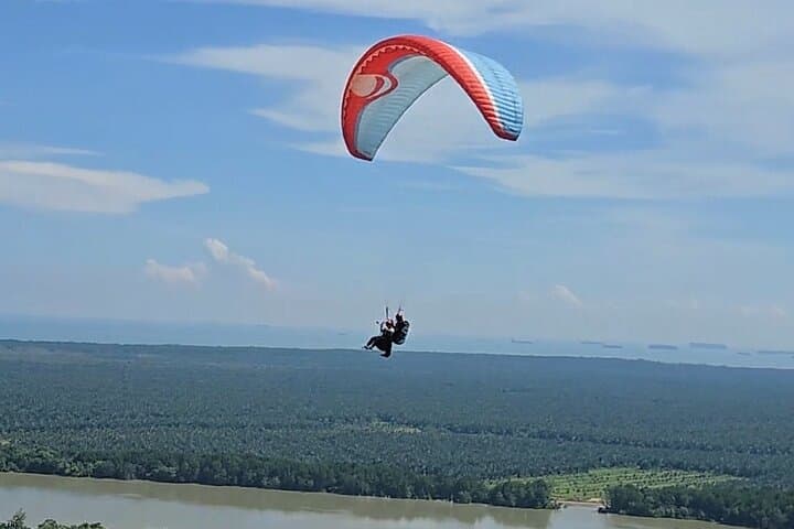 Tandem Paragliding at Bukit Jugra: Fly Above the Jugra Lighthouse and Straits of Malacca photo 1