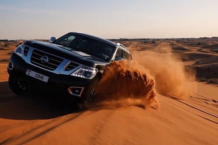 Sunset Desert Safari Dubai: Dune Bashing, Camel Ride & Dinner Under the Stars