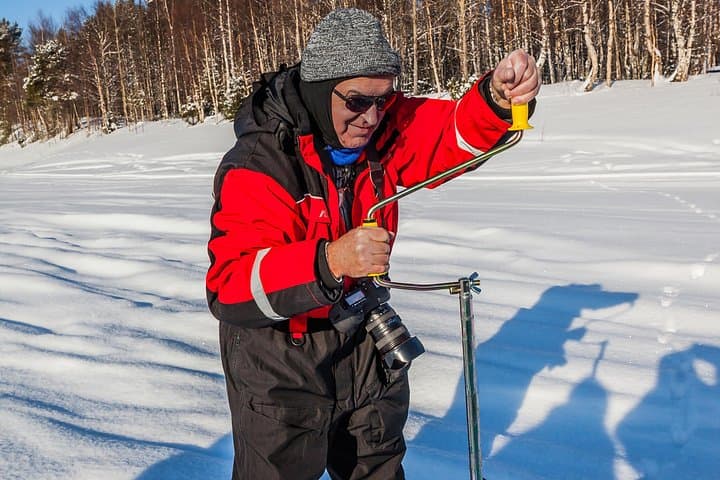 Ice Fishing on a Frozen Lake near Rovaniemi — Small-Group Arctic Experience photo 2