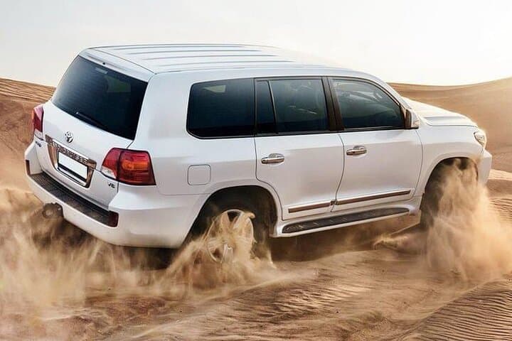 Dubai Desert Safari: Dune Bashing, Camel Rides, Sandboarding & Live BBQ