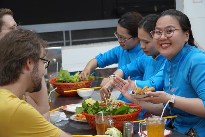 Saigon Michelin Scooter Food Tour with Female Ao Dai Guide