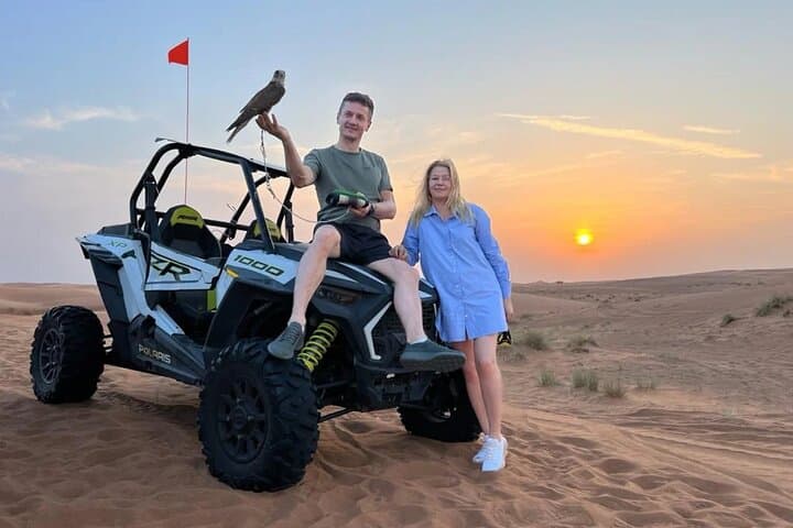 Drive the Red Dunes: 1-Hour Polaris Buggy Adventure with Camel Ride & Sandboarding