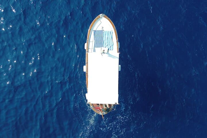 Sunset on a Classic Gozzo in Capri: Prosecco, Faraglioni & Punta Carena Views photo 2