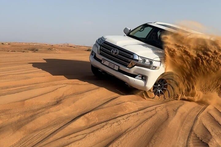 Dubai Land Cruiser Desert Safari: Dune-Bashing, Sunset & BBQ Camp Experience