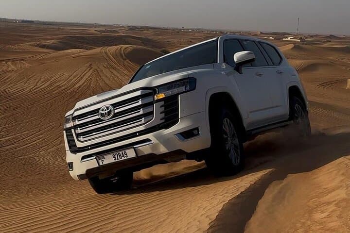 Dubai Half-Day Desert Safari: Dune Bashing, Camel Ride & BBQ BBQ Dinner Experience photo 2