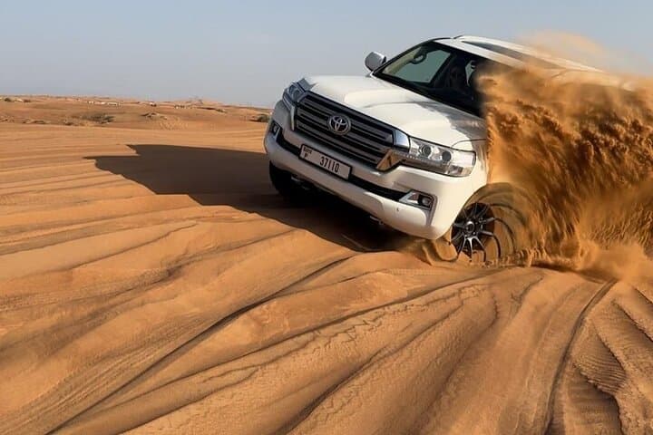 Dubai Half-Day Desert Safari: Dune Bashing, Camel Ride & BBQ BBQ Dinner Experience photo 3