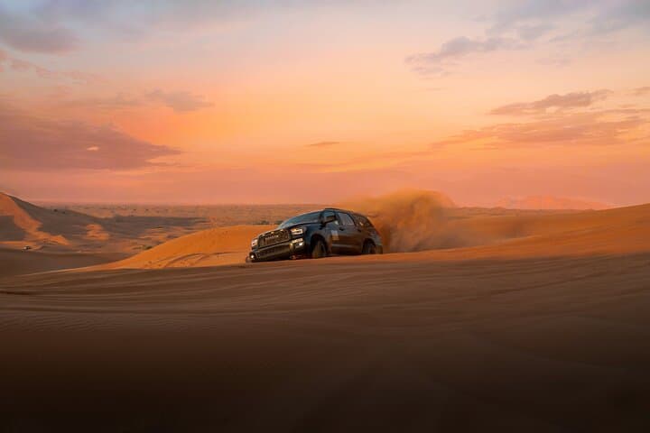 Evening Desert Safari Dubai — Red Dune Bashing, Camel Rides & Traditional Camp Experience