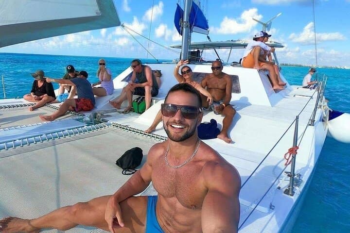 Private Catamaran Party to Isla Mujeres: Snorkel, Open Bar & Sunset Cruise photo 1