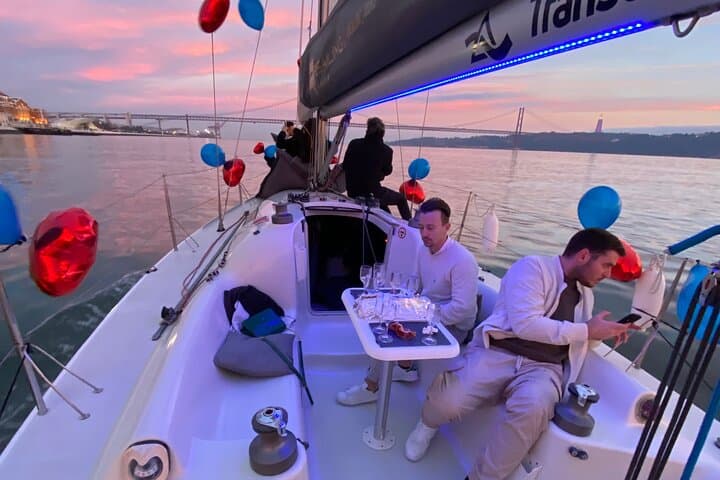 Sunset Sailboat Tour with Open Bar Vinho Verde in Lisbon