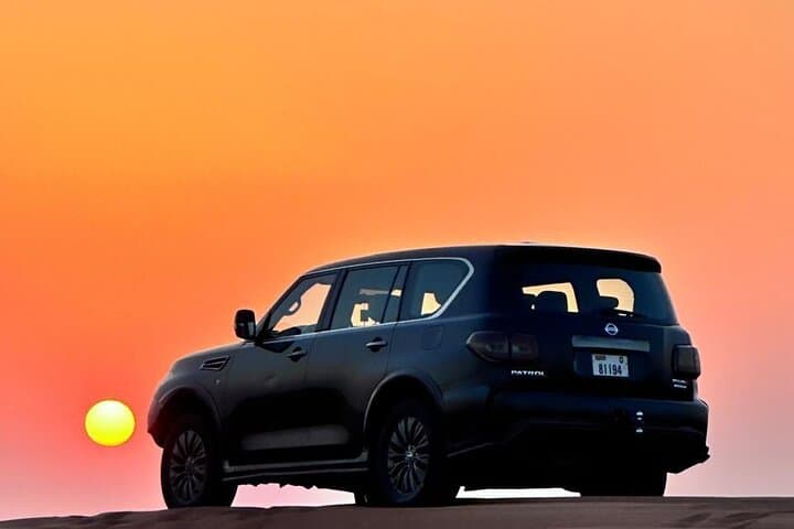Dubai Red Dune Evening Desert Safari & BBQ Dinner — Sunset Dune Bashing, Camel Rides, Live Shows