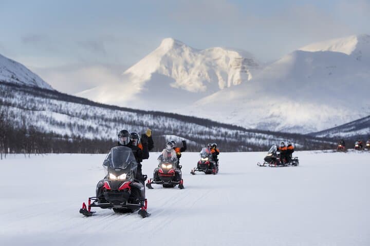 Thrill Through Arctic Wilderness: Adventure Snowmobile Safari from Tromsø