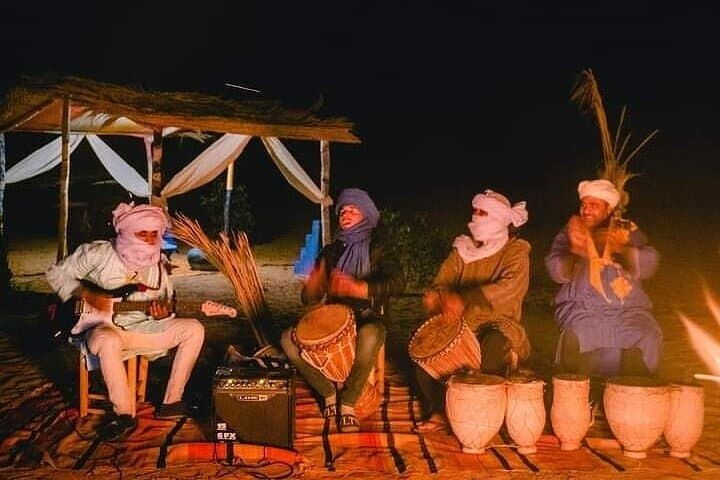 Sunset Dinner & Berber Music in Merzouga Desert — 4WD, Sandboarding & Camp Experience