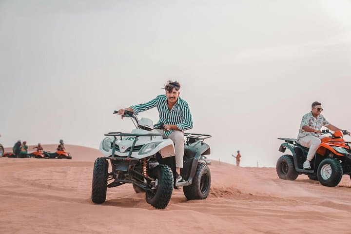 Dubai Desert Quad Bike Safari: ATV Ride, Camel Experience & Dune Photo Stop photo 2