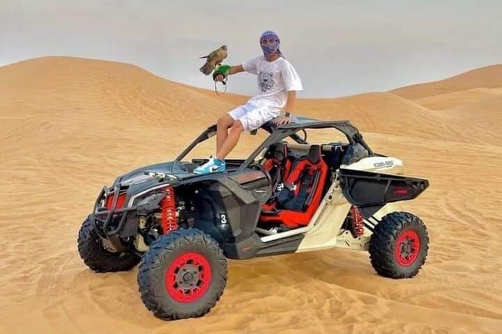 Evening Abu Dhabi Desert Safari with BBQ Dinner, Dune Bashing & Falcon Experience photo 4