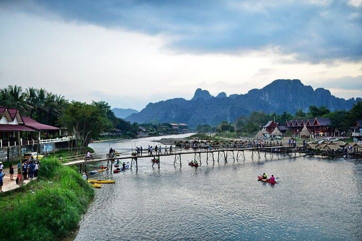 Vang Vieng Paragliding and Longtail Boat Tour with Hotel Pickup