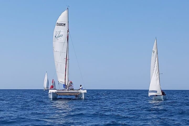 Sunset Catamaran Adventure in Porto Cesareo: Sail, Snorkel & Local Flavors photo 4