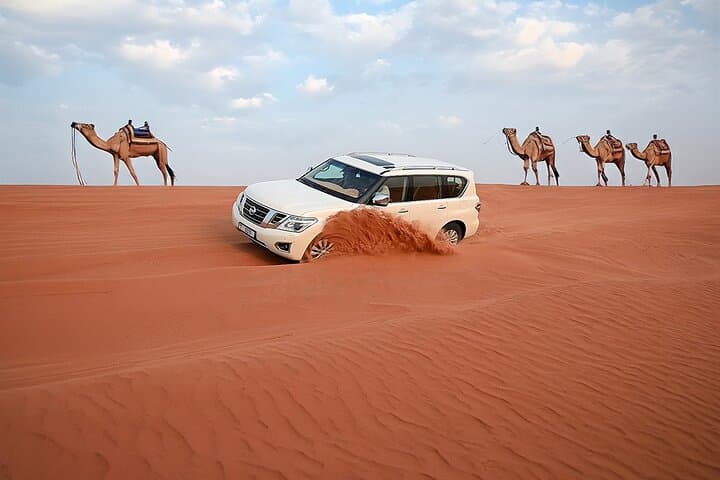 Dubai Red Dunes Desert Safari: Dune-Bashing, Sandboarding & Bedouin Camp Experience