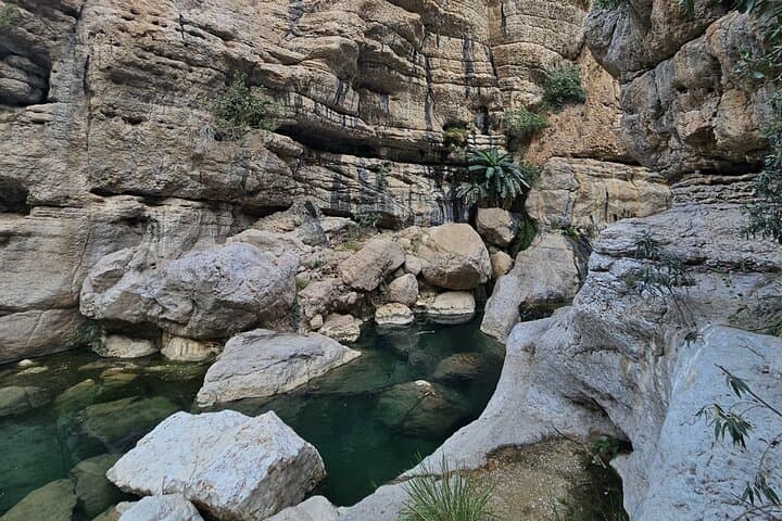Muscat Day Trip: Wadi Mibam & Bimmah Sinkhole — Mountain Pools and Coastal Cliffs