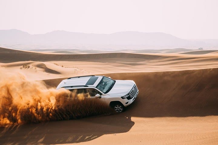 Dubai Red Dunes Desert Safari: Sunset Dune Bashing, Camel Rides & Bedouin Camp photo 1