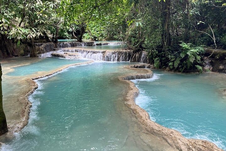 Pak Ou Caves & Kuang Si Falls Day Tour from Luang Prabang: Mekong Cruise, Buddha Caves & Hmong Village photo 2