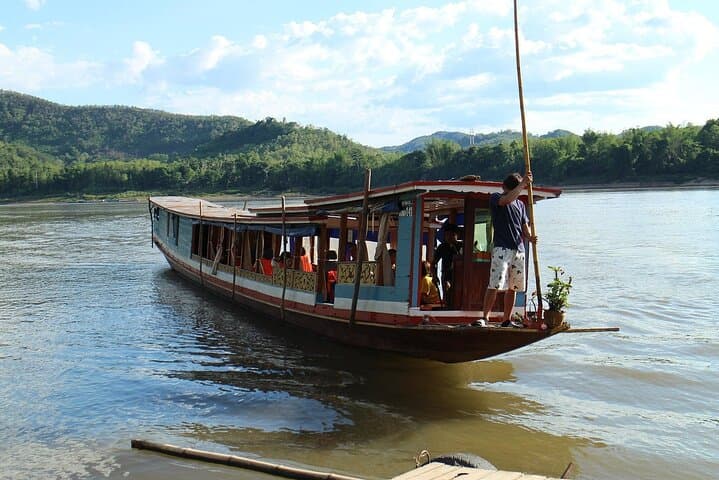 Pak Ou Caves & Kuang Si Falls Day Tour from Luang Prabang: Mekong Cruise, Buddha Caves & Hmong Village photo 4