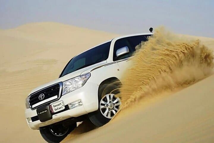 Sunrise Desert Safari in Doha: Camel Ride, Dune Bashing & Sandboarding photo 4