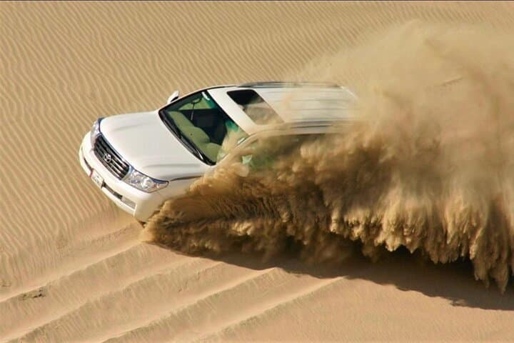 Sunrise Desert Safari in Doha: Camel Ride, Dune Bashing & Sandboarding photo 5