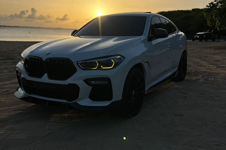 BMW X6 Luxury Transfer San Juan — Private Chauffeur with Champagne