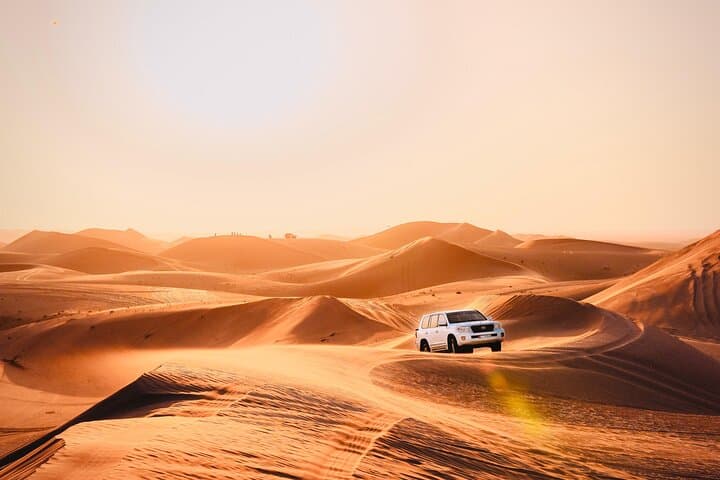 Abu Dhabi Evening Desert Safari: Dune Bashing, Camel Ride & BBQ Under the Stars photo 1