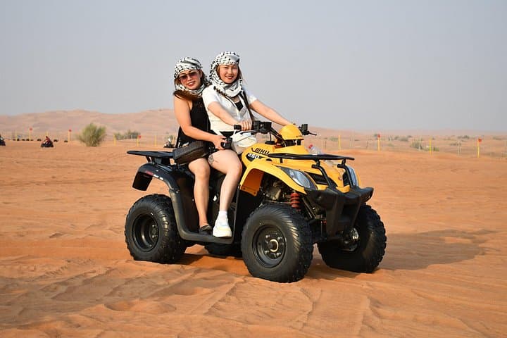 Dubai Red Dunes ATV and Evening Desert Safari: Quad Biking, Camel Ride & Premium BBQ Dinner
