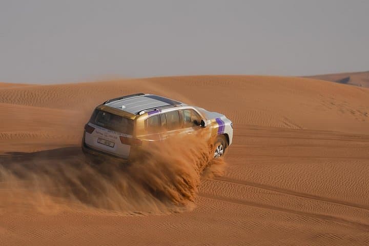 Dubai Morning Desert Safari: Dune Bashing, Camel Ride & Sandboarding photo 1