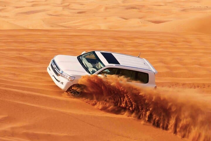 Evening Desert Safari Dubai — Red Dunes, Camel Ride & BBQ Guide