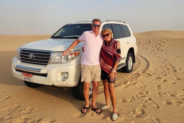 Evening Abu Dhabi Desert Safari with BBQ Dinner, Dune Bashing & Falcon Experience