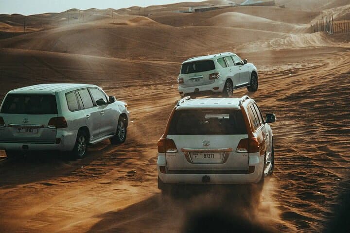Red Dunes Desert Safari Dubai — Dune Bashing, Camel Rides & BBQ Under the Stars