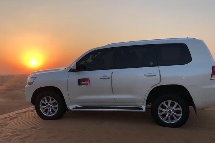 Sunrise Desert Safari in Dubai: Dune Bashing, Sandboarding & Bedouin Camp
