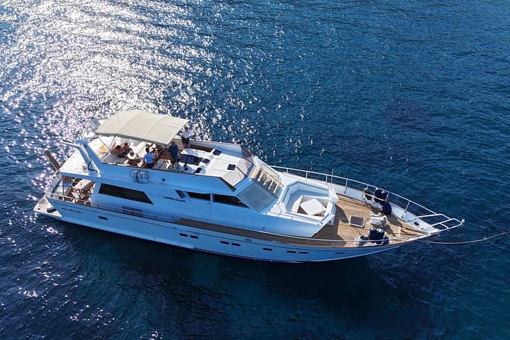 Yacht Cruise from Catania to Aci Trezza: Faraglioni, Snorkel & Prosecco photo 1