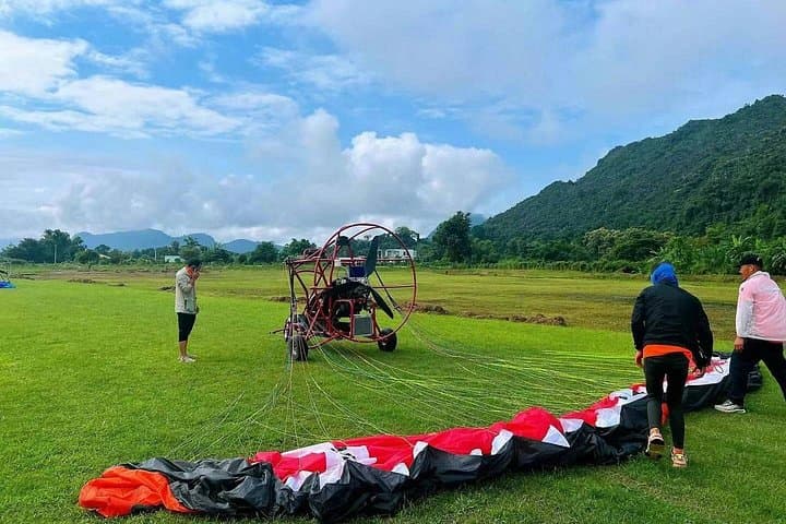 Vientiane to Vang Vieng: Full-Day Zipline, Caves, Kayak and Paragliding Adventure photo 3