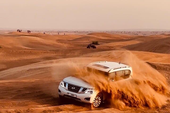 Dubai Desert Safari: Evening Dune Bashing, Sandboarding & BBQ Experience