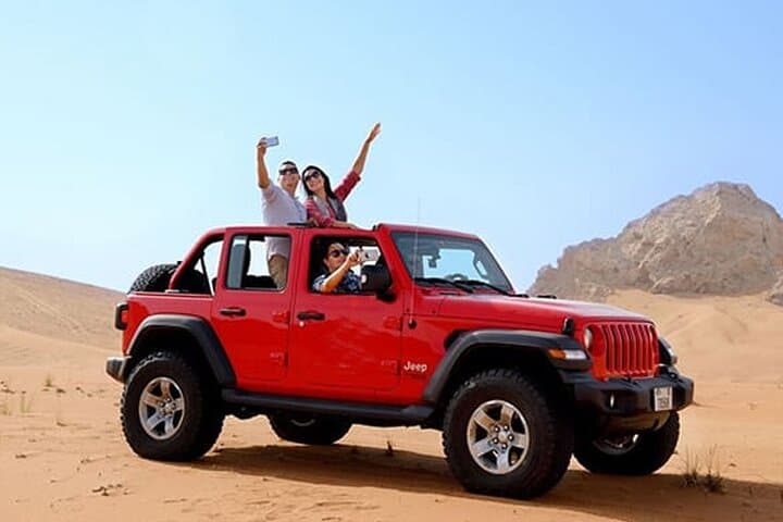 Sunset Jeep Desert Safari at Al Lahbab: Dune Bashing, Camel Ride & BBQ