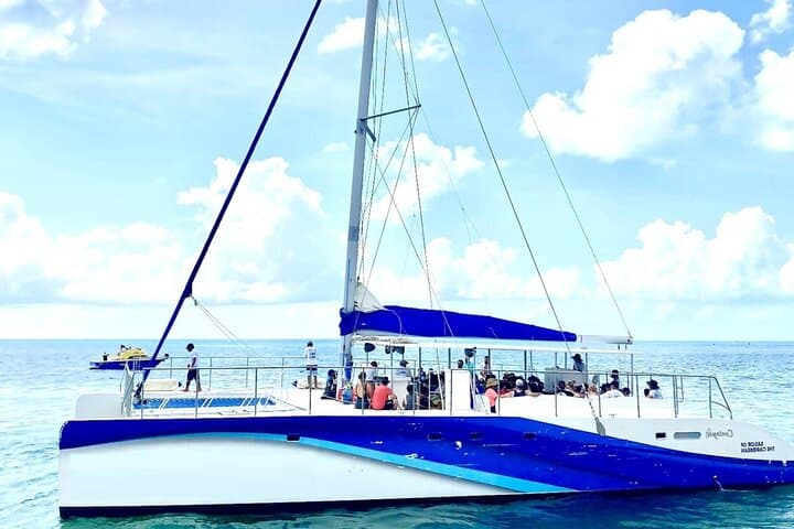 Private Catamaran to Isla Mujeres: Snorkel, Beach Buffet & Sunset Cruise