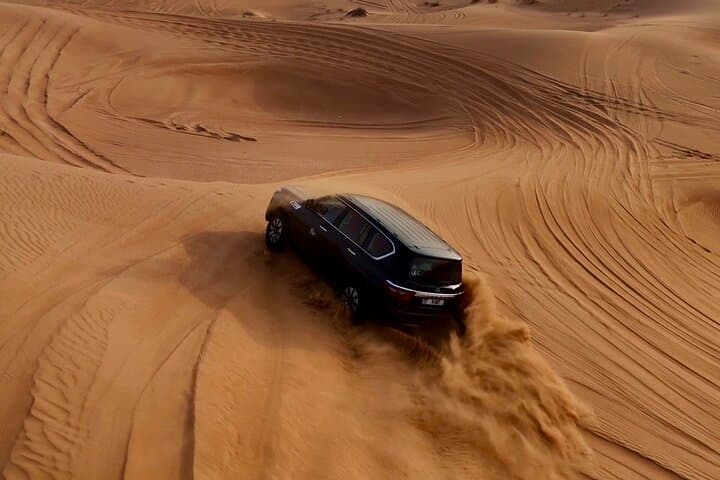 Dubai Red Dunes Premium Desert Safari: Camel Ride, Sandboarding & BBQ Dinner